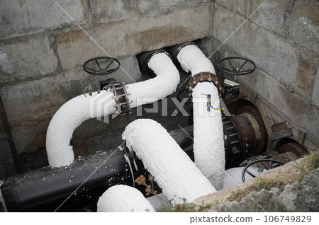 Reconstruction of the underground water supply systems on a city street. Water control main valve 106749829