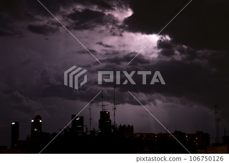 Ray. Storm. The sky is full of dark clouds in bad weather before a big storm rain. Light emission from the Edge of clouds. Zoom the surface of a Black haze at close range. Ray. Storm. The sky is full of dark clouds in bad weather before a big storm rain. Light emission from the Edge of clouds. Zoom the surface of a Black haze at close range. 106750126