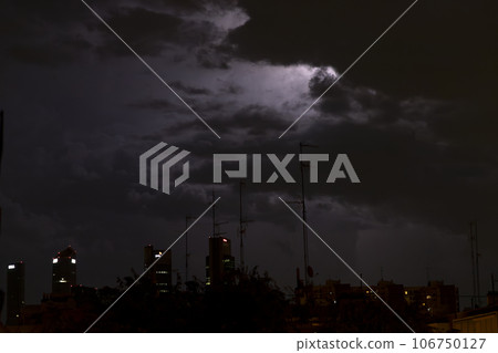 Ray. Storm. The sky is full of dark clouds in bad weather before a big storm rain. Light emission from the Edge of clouds. Zoom the surface of a Black haze at close range. Ray. Storm. The sky is full of dark clouds in bad weather before a big storm rain. Light emission from the Edge of clouds. Zoom the surface of a Black haze at close range. 106750127