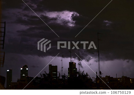 Ray. Storm. The sky is full of dark clouds in bad weather before a big storm rain. Light emission from the Edge of clouds. Zoom the surface of a Black haze at close range. 106750129