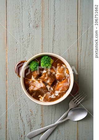 slow-cooked beef stew slow-cooked beef stew 106751662