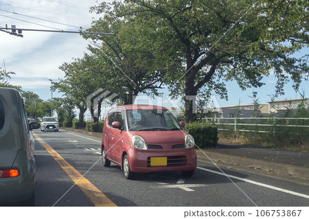 Small light passenger car road driving Small light passenger car road driving 106753867