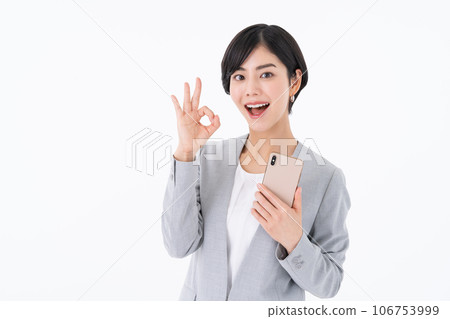 Business woman using a smartphone Business woman using a smartphone 106753999