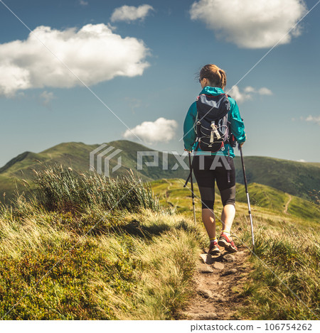 Young woman n the top of the mountains Young woman n the top of the mountains 106754262