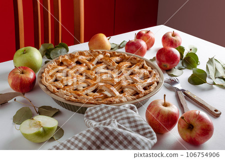 Homemade Apple Pie with fresh apples on a table background, Classic Thanksgiving dessert apple pie 106754906