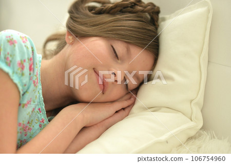 Cute little girl sleeping in bed at home 106754960