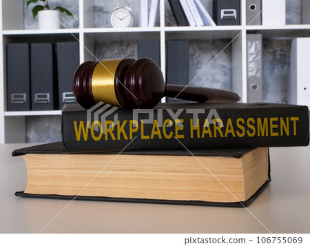 A book Workplace harassment with gavel lies on the office table. A book Workplace harassment with gavel lies on the office table. 106755069