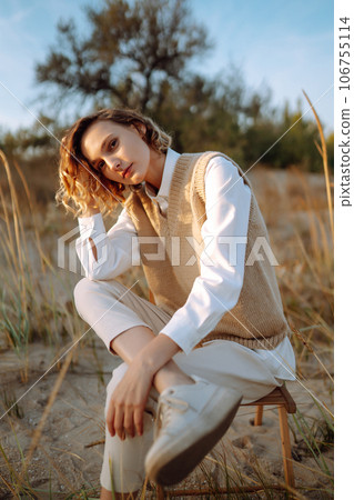 Portrait of elegant, luxury woman posing in nature. People, lifestyle, relaxation concept. 106755114