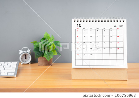 The October 2023, Monthly desk calendar for 2023 year on wooden table. The October 2023, Monthly desk calendar for 2023 year on wooden table. 106756968