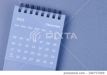 The December 2023 Monthly desk calendar for 2023 year on blue background. The December 2023 Monthly desk calendar for 2023 year on blue background. 106757009