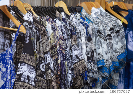 Beautiful patterned on the Thai style garment, elephant patterned and clothing for sale at the local market. Beautiful patterned on the Thai style garment, elephant patterned and clothing for sale at the local market. 106757037