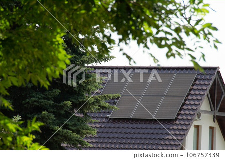 Installing a Solar Cell on a Roof. 106757339