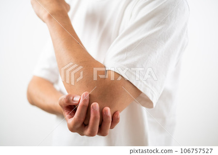 Man with arm/elbow pain Man with arm/elbow pain 106757527