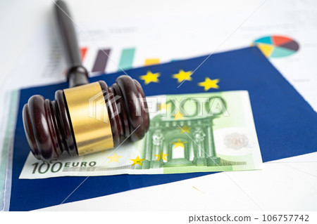 Gavel for judge lawyer and Euro dollar banknotes on EU flag, finance concept. Gavel for judge lawyer and Euro dollar banknotes on EU flag, finance concept. 106757742