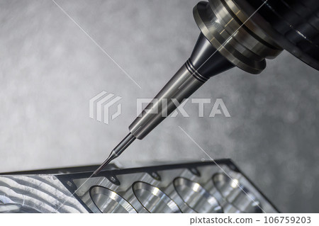 Close up scene the 5-axis machining center cutting the V8 engine cylinder block with solid ball end mill tool. 106759203