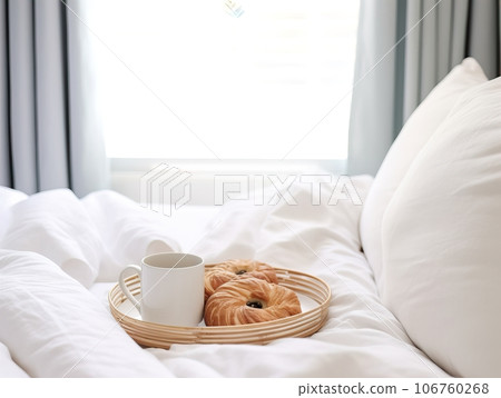 Beautiful cozy breakfast in bed, home bedroom interior with bright morning light, healthy food on decorated tray, weekend meal 106760268