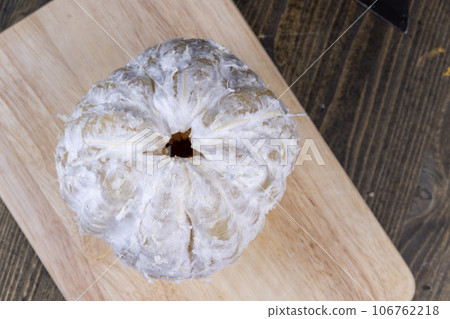 peeled ripe and juicy pomelo close-up, ripe pomelo 106762218