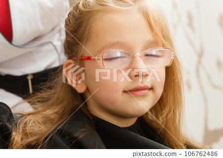 Happy toddler girl in eyeglasses Happy toddler girl in eyeglasses 106762486