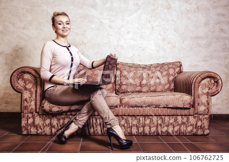 Business woman using computer. Internet home technology. Vintage photo. Business woman using computer. Internet home technology. Vintage photo. 106762725