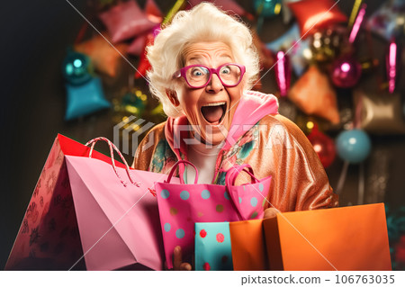 Happy older woman shouts joyfully and holds shopping bags. Concept of shopping, sales season, Black Friday 106763035