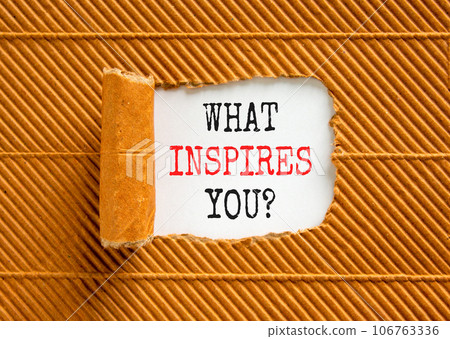What inspires you symbol. Concept words What inspires you on beautiful white paper. Beautiful brown background. Business motivational what inspires you concept. Copy space. 106763336