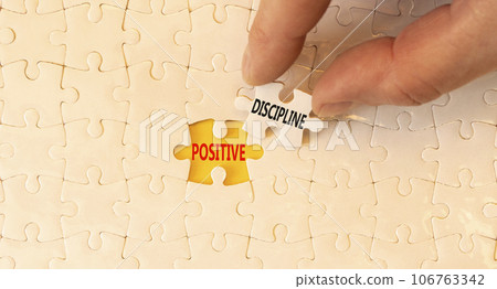 Positive discipline symbol. Concept words Positive discipline on beautiful white paper puzzles. Beautiful yellow paper background. Business psychology positive discipline concept. Copy space. 106763342