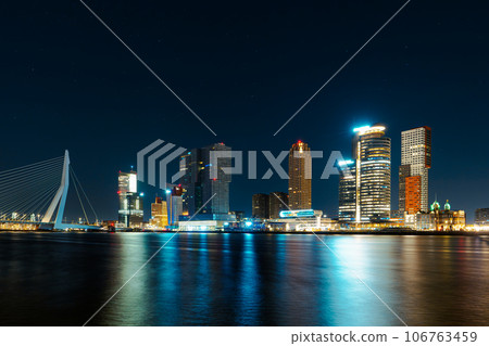 Timeless Beauty of Rotterdam's Nightfall, Where Skyscrapers Sparkle Amidst Reflections on the Water Timeless Beauty of Rotterdam's Nightfall, Where Skyscrapers Sparkle Amidst Reflections on the Water 106763459