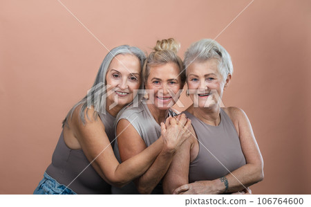 Studio portrait of three beautiful senior women with gray hairs 106764600
