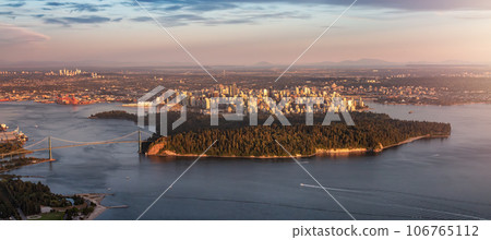 Aerial View of Stanley Park and Downtown Vancouver City on Ocean Coast. Sunset Aerial View of Stanley Park and Downtown Vancouver City on Ocean Coast. Sunset 106765112