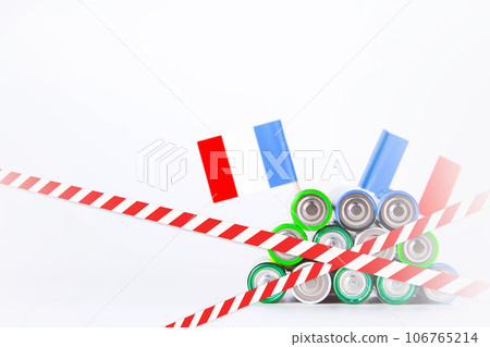 Battery. A lot of batteries on the background of the flag of the country. 106765214