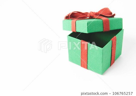Present. Gift box with a bow. New Year's surprise. Red and green box with a gift 106765257