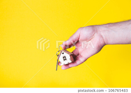 Buying a house. The buyer receives the key to the property. 106765483