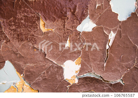 Cracked paint texture. Grunge wall texture. Dark wall with old paint Cracked paint texture. Grunge wall texture. Dark wall with old paint 106765587
