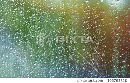 Sun after rain. Drops on glass. It's been raining. Texture on glass. 106765818
