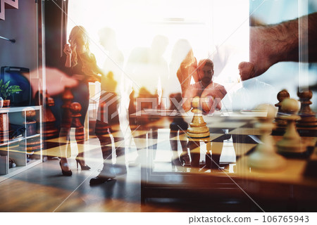 Silhouette of business people in the office. double exposure with chessboard Silhouette of business people in the office. double exposure with chessboard 106765943