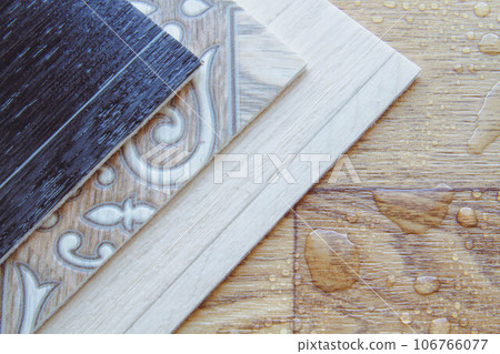 Waterproofness of linoleum. Waterproof linoleum in the kitchen. Sample roll. Waterproofness of linoleum. Waterproof linoleum in the kitchen. Sample roll. 106766077