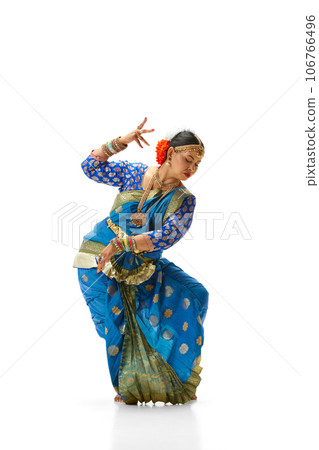 Bharatanatyam dance. Beautiful, talented indian woman in traditional clothes dancing against white studio background 106766496