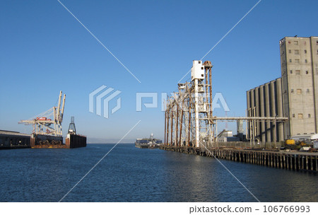 Islais Creek Channel lined with industrial machines Islais Creek Channel lined with industrial machines 106766993