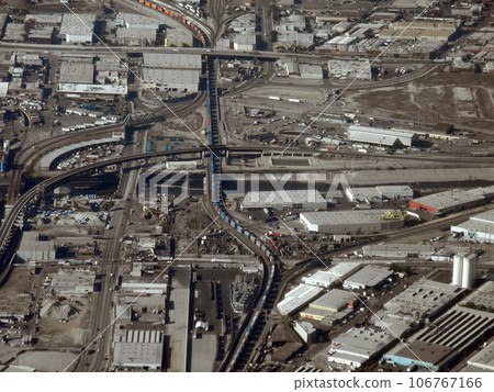 Long train runs though LA aerial view 106767166