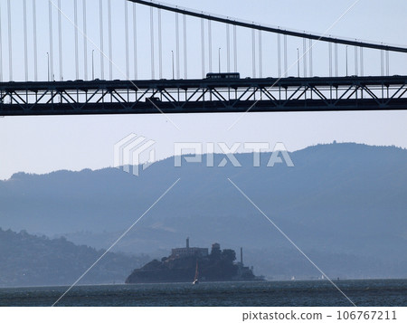 Bay Bridge suspension span with Alcatraz Island in the distance underneath , San Francisco 106767211
