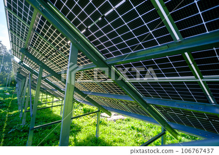 Solar panel with nano coating. Renewable energy from the sun, green energy, concept Generate energy. View of the panels from the other side. Metal constructions. Solar panel with nano coating. Renewable energy from the sun, green energy, concept Generate energy. View of the panels from the other side. Metal constructions. 106767437