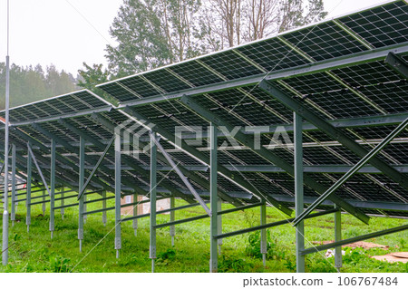 Solar panel with nano coating. Renewable energy from the sun, green energy, concept Generate energy. View of the panels from the other side. Metal constructions 106767484