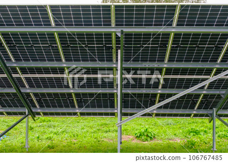 Solar panel with nano coating. Renewable energy from the sun, green energy, concept Generate energy. View of the panels from the other side. Metal constructions Solar panel with nano coating. Renewable energy from the sun, green energy, concept Generate energy. View of the panels from the other side. Metal constructions 106767485