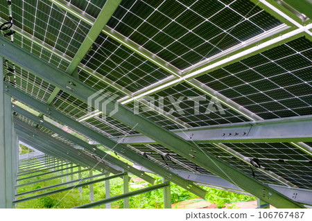 Solar panel with nano coating. Renewable energy from the sun, green energy, concept Generate energy. View of the panels from the other side. Metal constructions 106767487