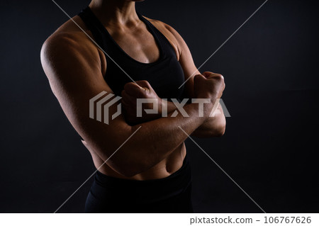 Close up of woman back with her muscles after workout. Female bodybuilder with perfect biceps 106767626