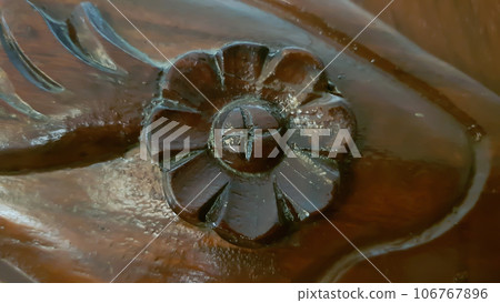 beautiful dark brown flower design on wooden furniture 106767896