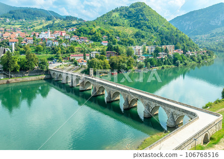 Mehmed Pasa Sokolovic Bridge over Drina river with city panorama, Visegrad, Bosnia 106768516