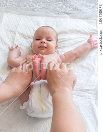 Infant finds relief through massage. Concept of maternal care for colic 106768678