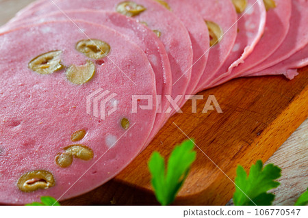 Mortadella sausage with olives 106770547