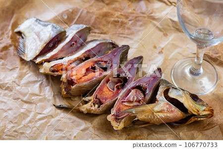 Aromatic dried-cured bream served for snack Aromatic dried-cured bream served for snack 106770733